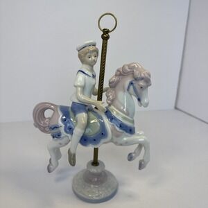 LLADRO STYLE~Paul Sebastian, sailor child on carousel horse figurine dated 1990